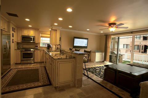 Transitional Kitchen with black and beige area rug