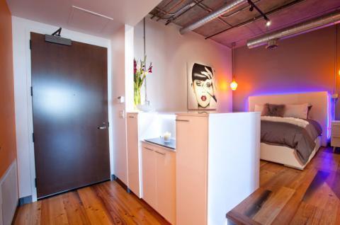 Contemporary Bedroom with white upholstered head board