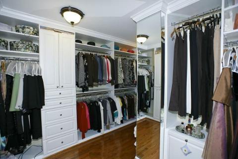 Traditional Closet with white organizational cabinets