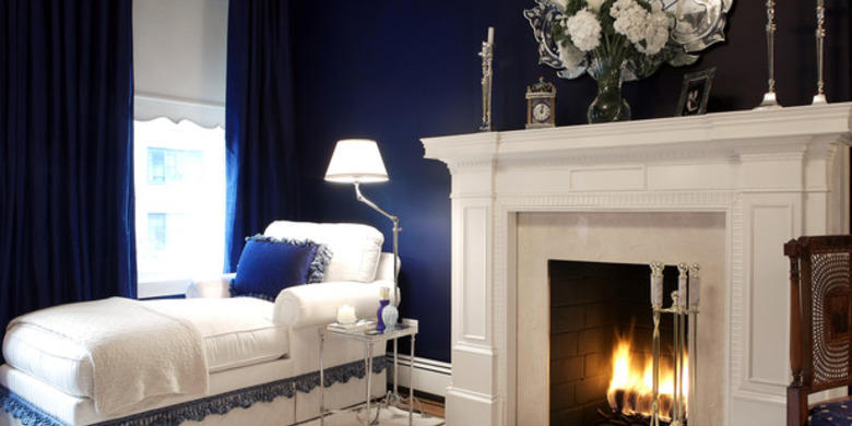#htmlcaption5 Transitional Bedroom with beautiful elegant mirror above fire place mantel