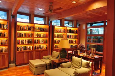 Contemporary Library with green upholstered lounge chairs