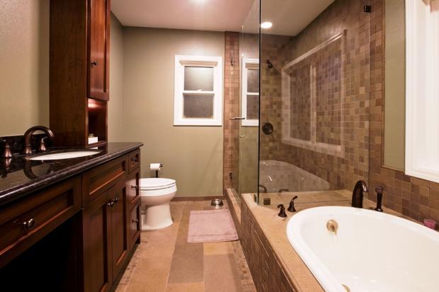 Contemporary Master Bathroom with glass shower stall door and walls