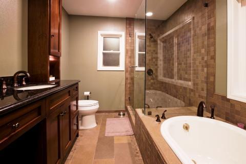 Contemporary Master Bathroom with glass shower stall door and walls