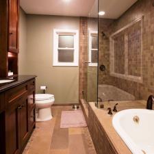 Contemporary Master Bathroom with glass shower stall door and walls