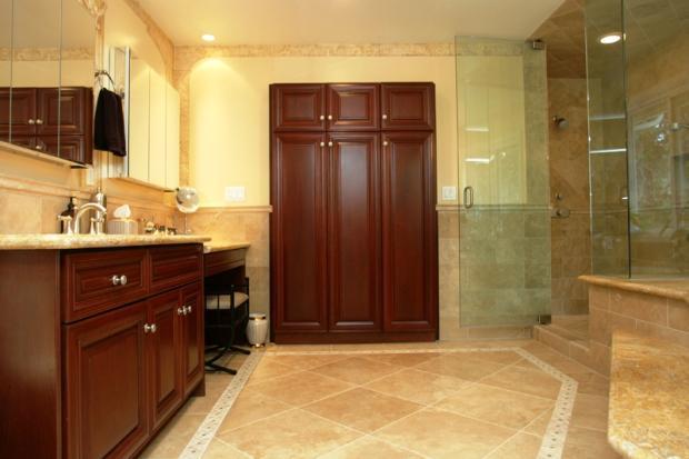 Transitional Master Bathroom with dark wood stained vanity cabinet