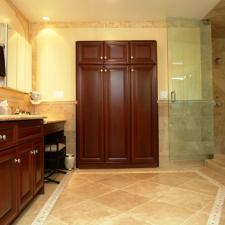Transitional Master Bathroom with dark wood stained vanity cabinet