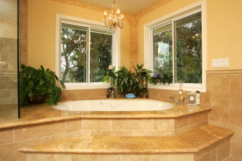Traditional Master Bathroom with white porcelain drop in tub