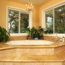 Traditional Master Bathroom with white porcelain drop in tub