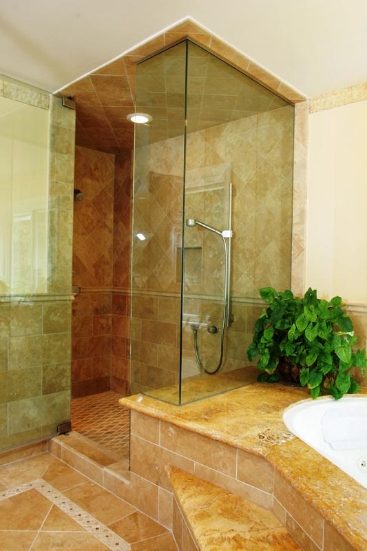 Transitional Master Bathroom with small brown stone tile shower flooring