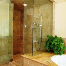 Transitional Master Bathroom with small brown stone tile shower flooring