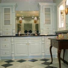 Traditional Master Bathroom with frosted glass front cabinet doors