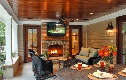 Transitional Patio with black metal outdoor dining table and chairs