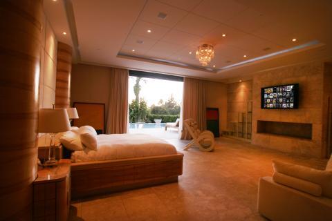 Contemporary Bedroom with crystal ceiling mounted light fixture