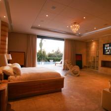 Contemporary Bedroom with crystal ceiling mounted light fixture