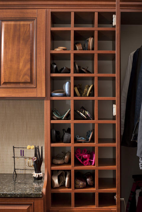 Traditional Closet with dark granite countertop