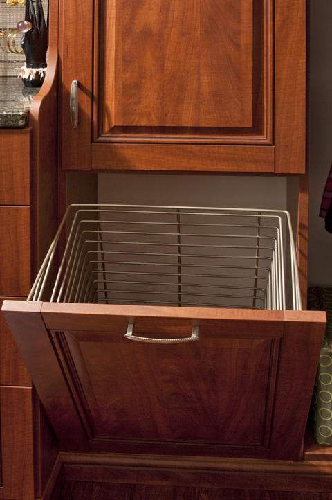 Traditional Closet with medium stained raised panel doors
