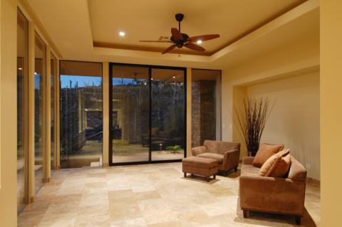 Contemporary Sunroom with suede upholstered chairs