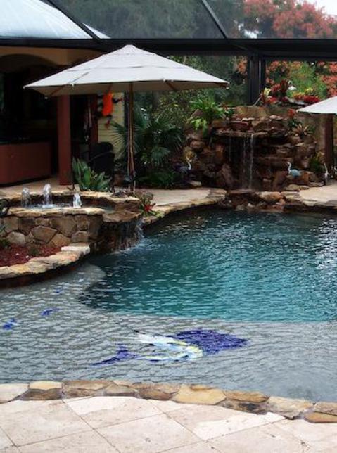 Traditional Pool with waterfall into pool