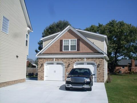 Traditional Garage with black metal garage door hardware