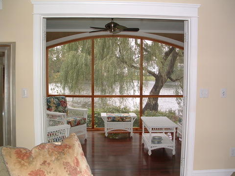 Traditional Sunroom with wide white crown molding
