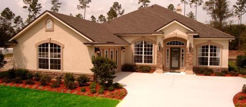Traditional Driveway with wall sconces on exterior
