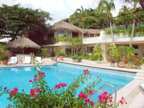 Traditional Home Exterior with large outdoor planters