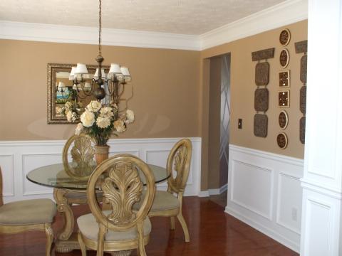 Traditional Dining Room with distressed white dining chair