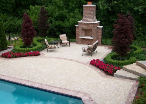 Traditional Pool with outdoor brick fireplace with tall chimney