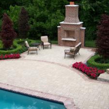 Traditional Pool with outdoor brick fireplace with tall chimney