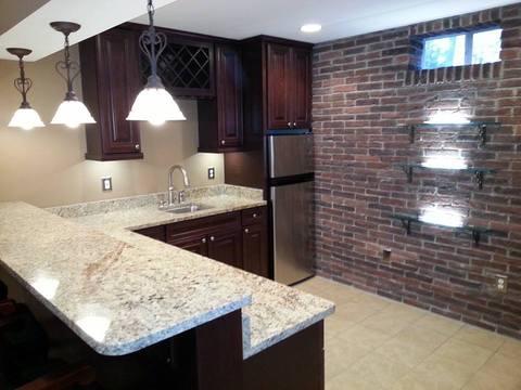 Traditional Basement with rich toned stain cabinet finish