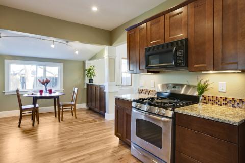 Contemporary Kitchen with track lighting over dining table