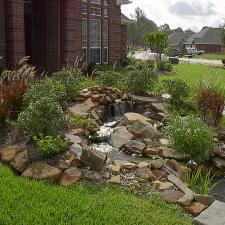 Traditional Landscape with grass landscaped yard