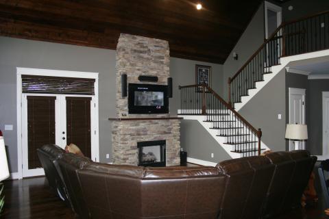 Traditional Living Room with dark brown leather sectional sofa