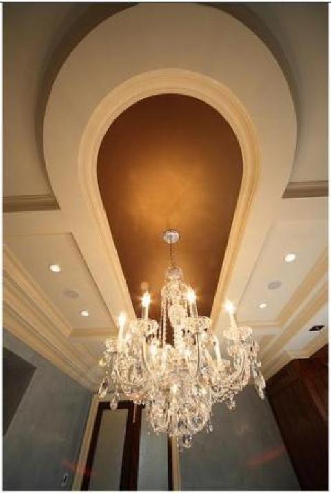 Traditional Dining Room with wood mill work on ceiling