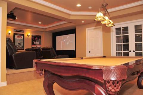 Contemporary Home Theater with dark wood pool table