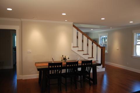 Traditional Dining Room with white and wood stairs