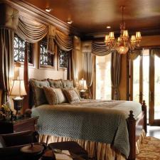 Traditional Bedroom with wood framed glass french doors