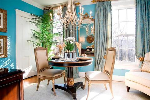 Eclectic Dining Room with gold trim black circular table