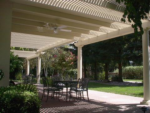 Traditional Patio with off white columns around patio
