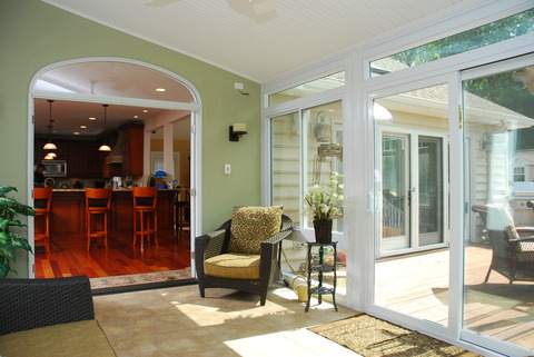 Traditional Sunroom with light green painted walls