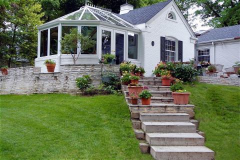 Traditional Walkway with brick home with conervatory