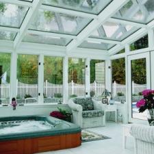 Traditional Sunroom with white wicker patio furniture