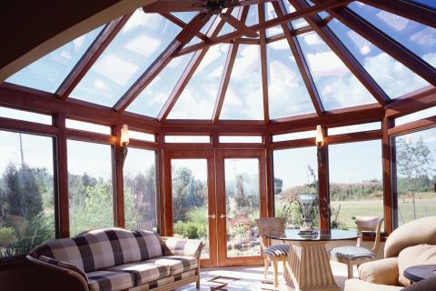 Contemporary Sunroom with wood and upholstery sofa