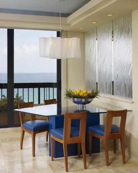 Transitional Dining Room with blue leather cushions on dining chairs