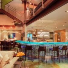Contemporary Family Room with blue lights in glass counter