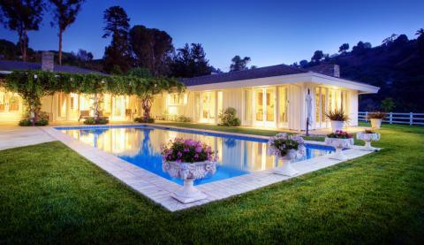 Traditional Pool with ceramic elegantly detailed outdoor planters