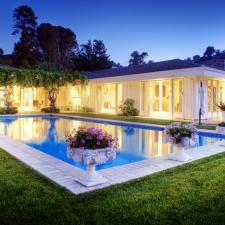 Traditional Pool with ceramic elegantly detailed outdoor planters