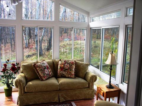 Traditional Living Room with small light wood side table