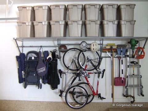 Traditional Garage with wall hung organizational shelves