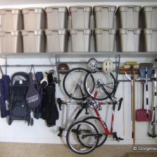 Traditional Garage with wall hung organizational shelves